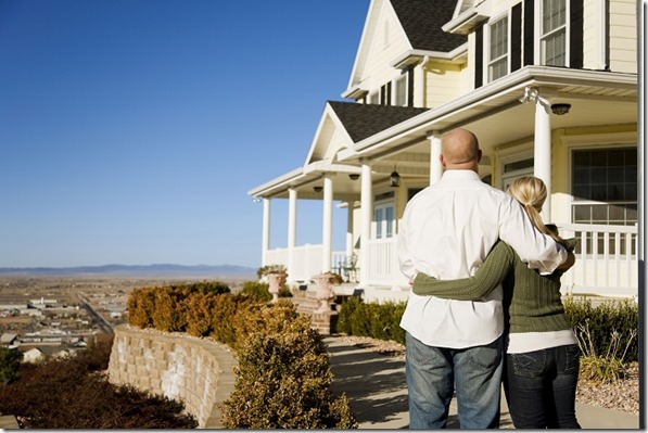 Couple-Looking-Out-by-their-Home1